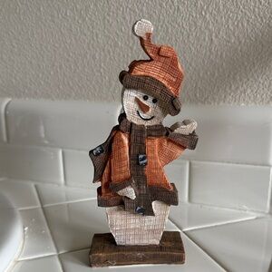 Charming Holiday Snowman with Orange and Brown Accents